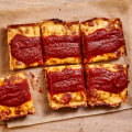 What style of pizza has sauce on top?