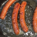 How do you know when hot dogs are done on the stove?
